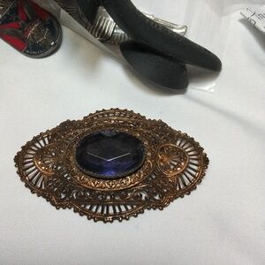 Large purple brooch